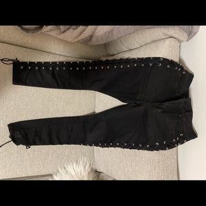 Black Toxik3 jeans with criss cross detail